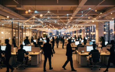 Open-office - WYSIWYG Computers Open-plan office with rows of desks and computers, silhouetted workers moving under decorative interconnected light strands overhead.